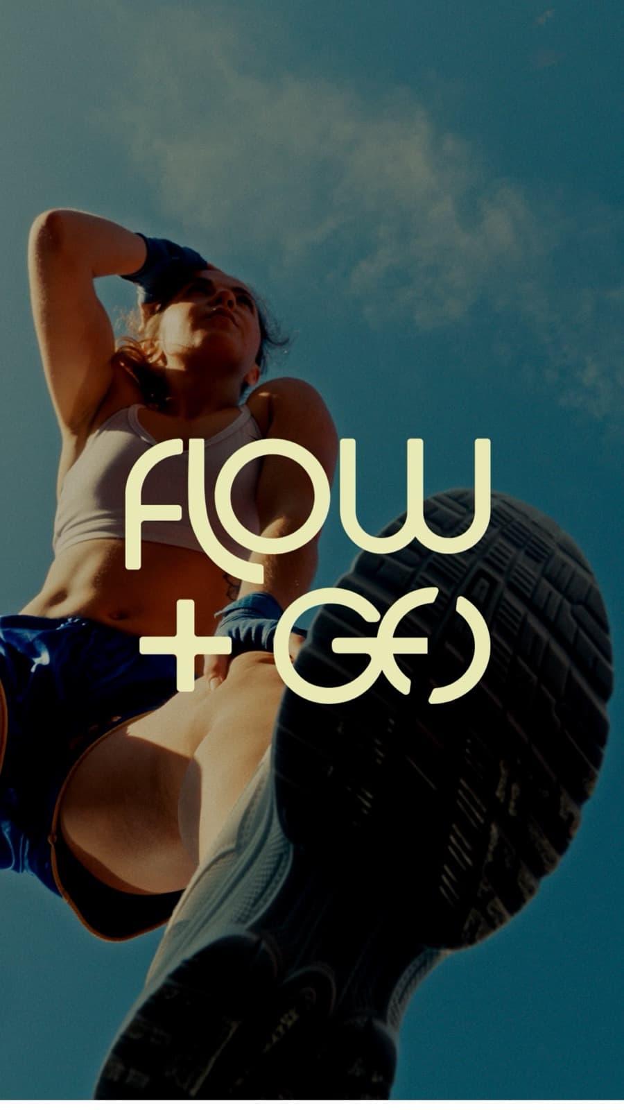 Flow + Go wordmark over a low-angle running photograph against a clear blue sky