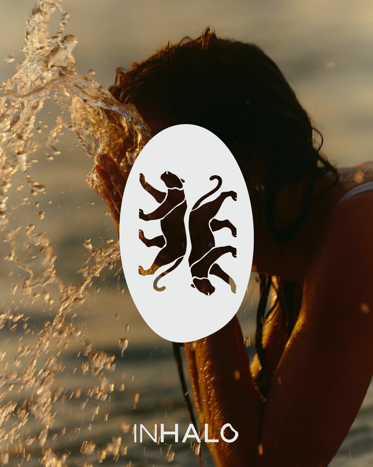 Inhalo twin panther mark in a white oval over a golden-hour water splash portrait