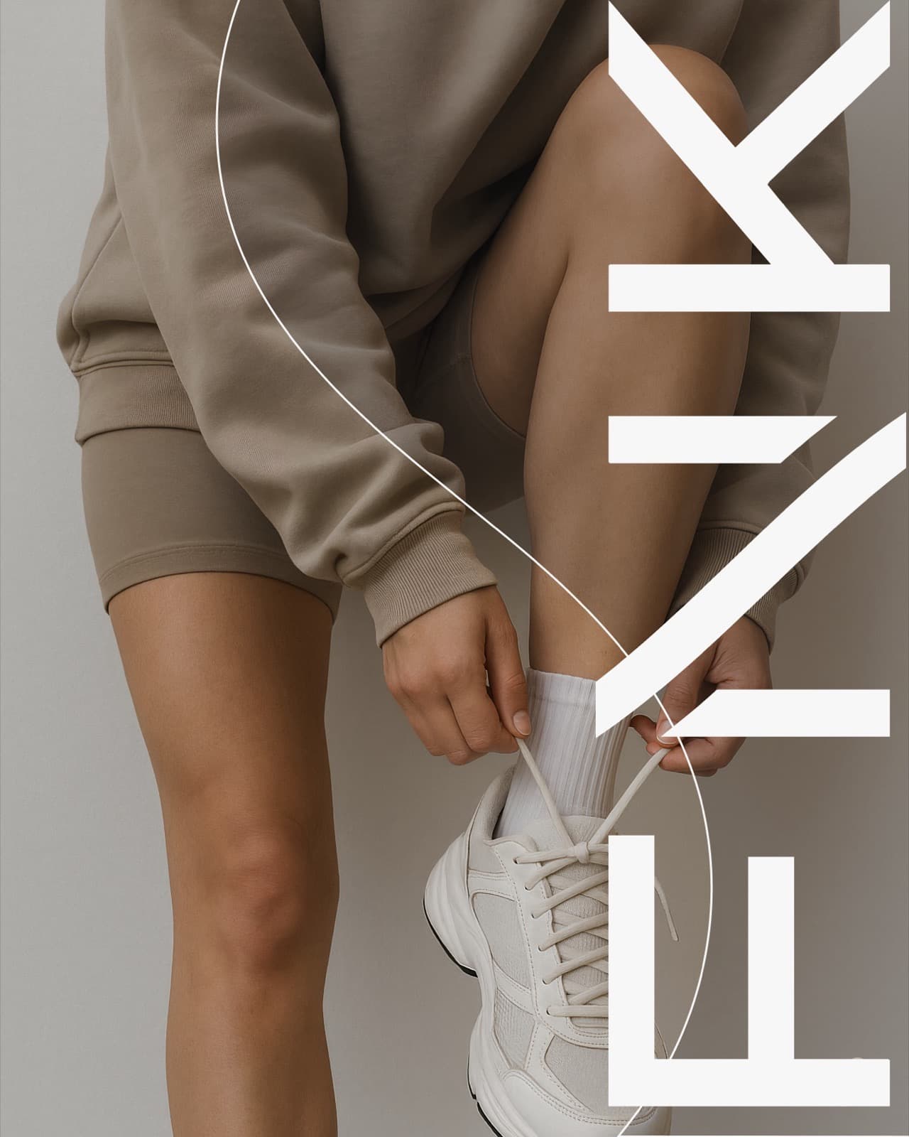 Vertical FNK wordmark over taupe athleticwear photography of someone tying sneakers