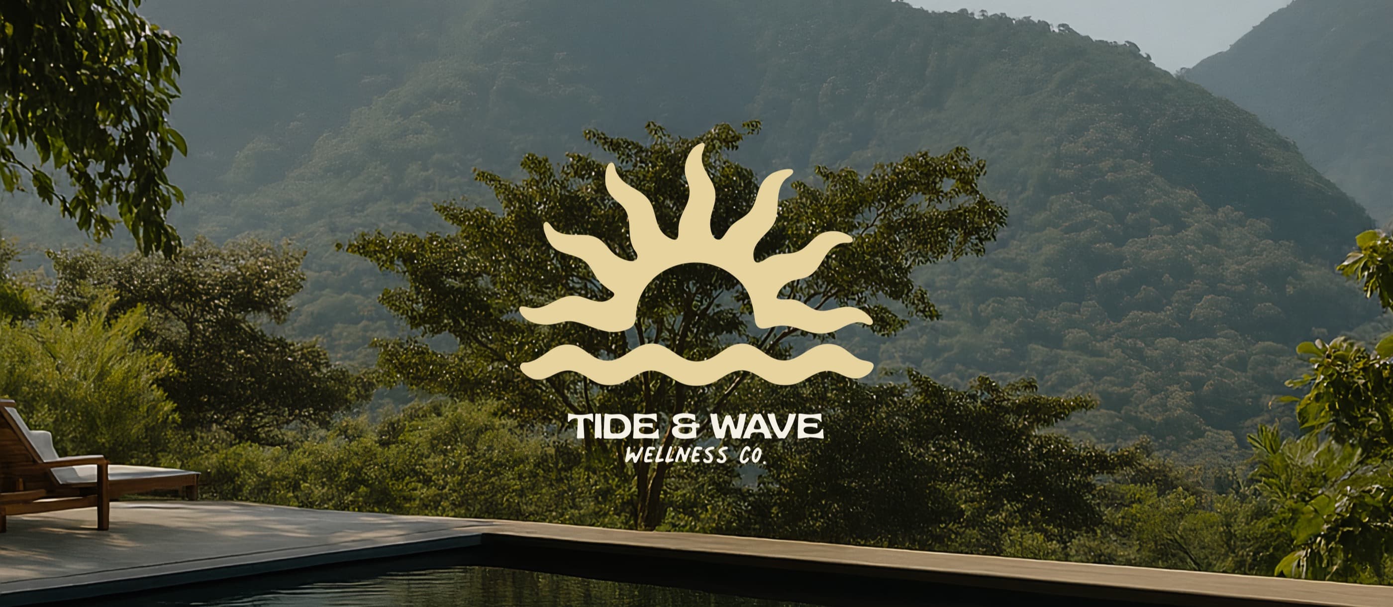 Tide And Wave Wellness sun and wave mark over a pool deck looking toward misty hills