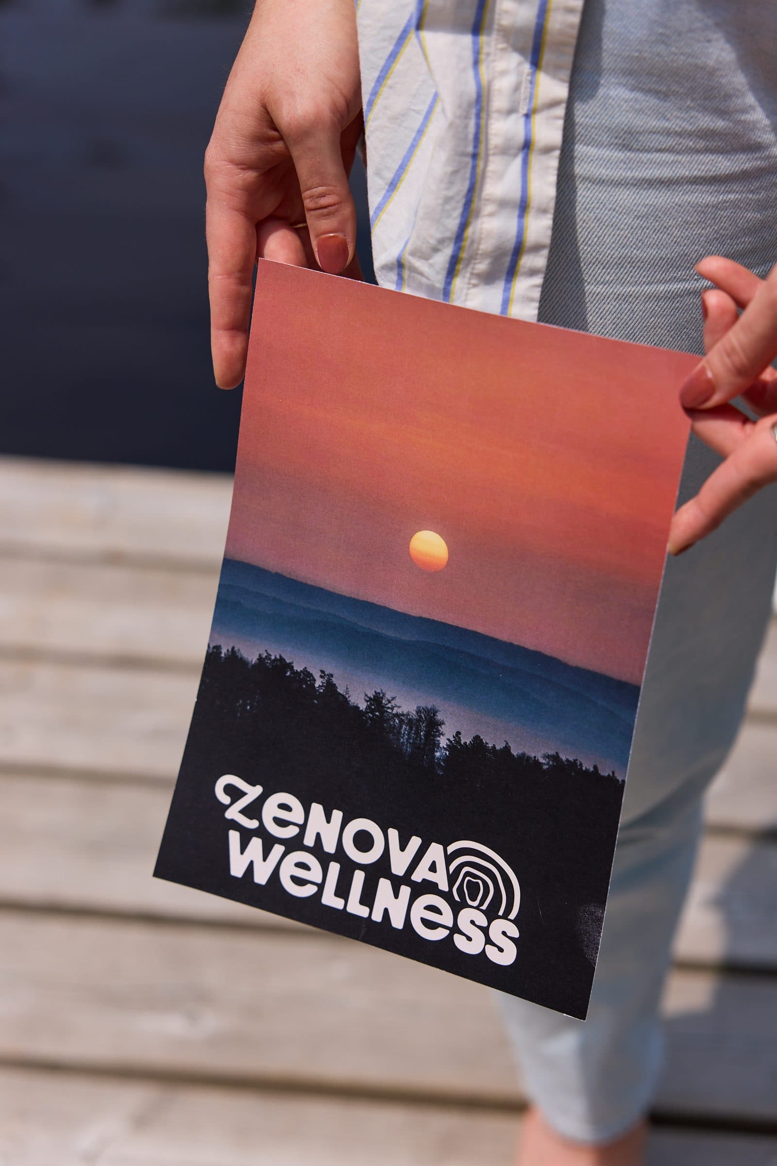 Printed Zenova Wellness brand presentation held outdoors